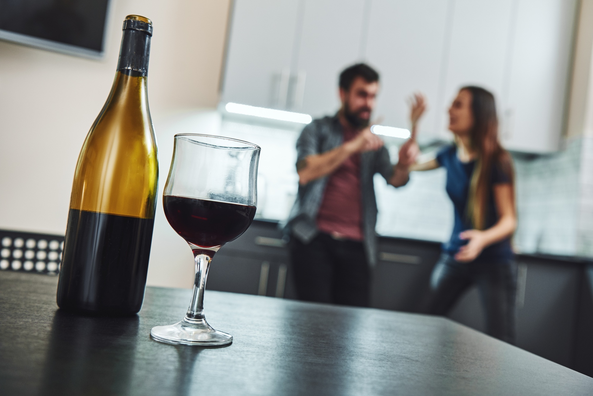 Addiction denied is recovery delayed. Family of alcoholics. Couple having an argument in the kitchen