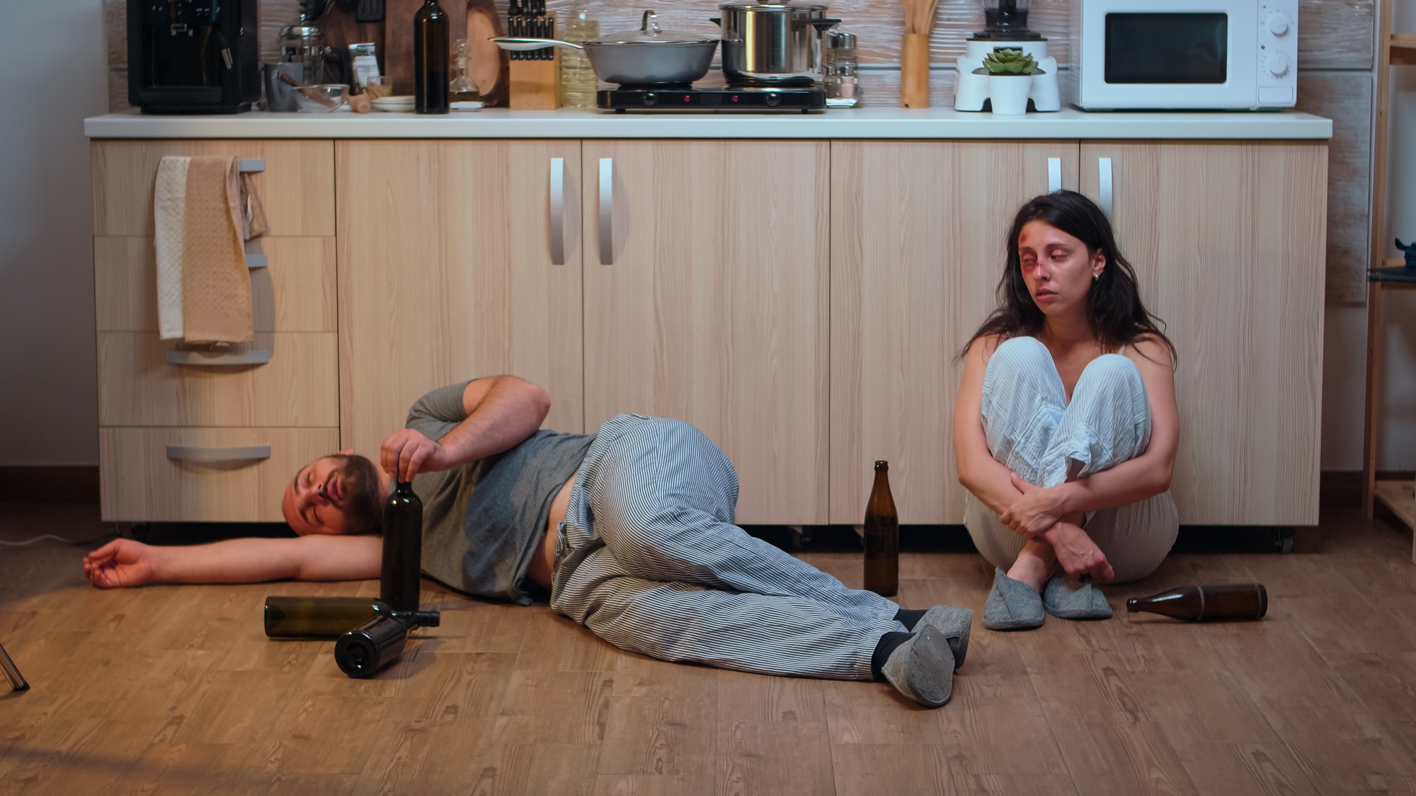 Alcoholic man lying on the floor